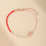 Bracelet Cordon Rouge et Nacre pour l'Abondance - Biloria