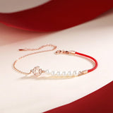 Bracelet Cordon Rouge et Nacre pour l'Abondance - Biloria